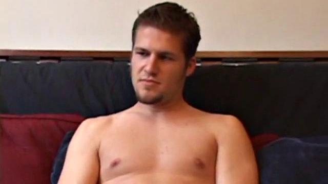 Straight Alex West is turned on by the porn that's playing and quickly gets a stiff one. As he strokes his cock, Alex stuffs his butt with a dildo and busts a load onto his belly.