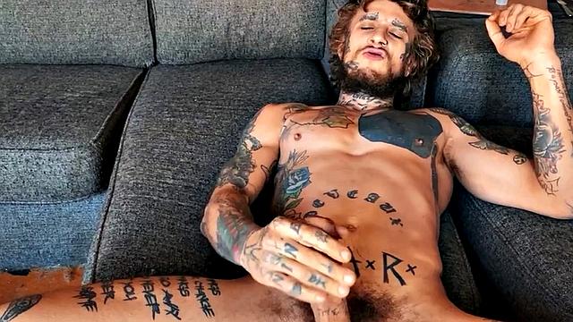 Inked stud fingering tight asshole while jerking