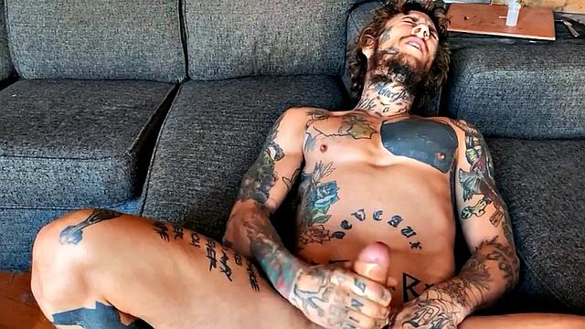 Inked stud fingering tight asshole while jerking