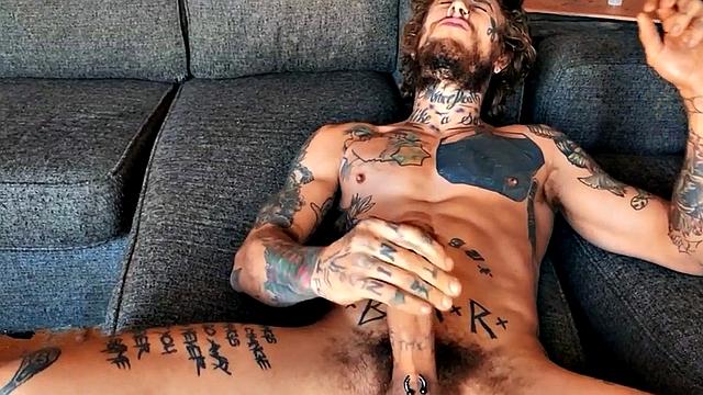 Inked stud fingering tight asshole while jerking