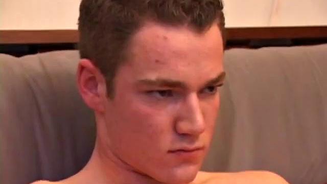 Brayden jacks off on the sofa, while he watches a porn video, and then moves to the floor so he can suck on the head of his dick. After a good stroking, Brayden shoots his cum load onto his tongue and face.