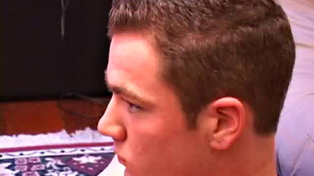 Brayden jacks off on the sofa, while he watches a porn video, and then moves to the floor so he can suck on the head of his dick. After a good stroking, Brayden shoots his cum load onto his tongue and face.