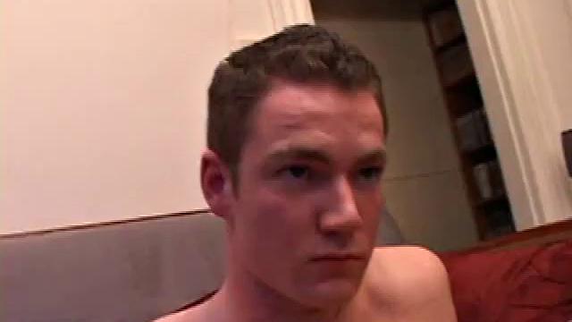 Brayden jacks off on the sofa, while he watches a porn video, and then moves to the floor so he can suck on the head of his dick. After a good stroking, Brayden shoots his cum load onto his tongue and face.