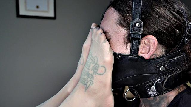 Femdom busty MILF in stockings whipping foot sub