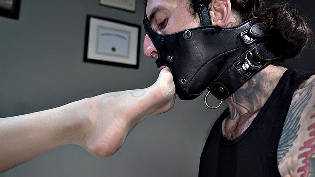 Femdom busty MILF in stockings whipping foot sub