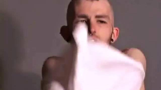 Nick Stevens with facial hair and piercings strokes cock to porn, keeps the t-shirt on