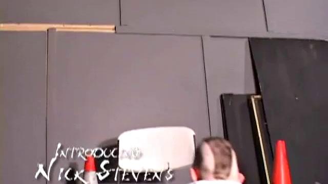 Nick Stevens with facial hair and piercings strokes cock to porn, keeps the t-shirt on