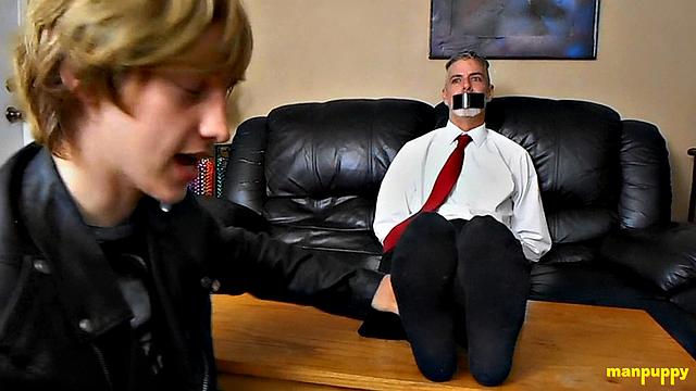 Elis Ataxxx tickles Richard Lennox's feet and gets playful with his professor