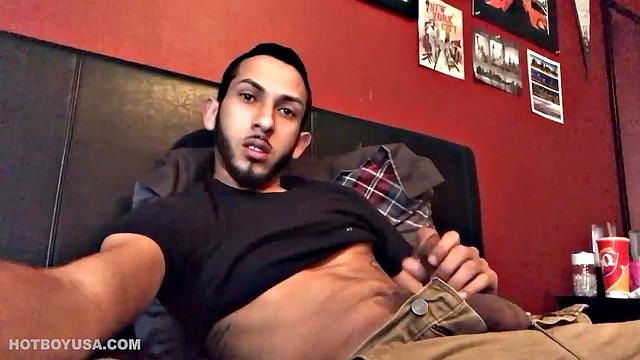 Brian Bonerz starts off in bed, with pants pushed down just enough to release his big stiff cock and balls. He starts stroking and then pauses briefly to remove one of the two shirts he's wearing.