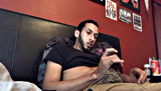 Brian Bonerz starts off in bed, with pants pushed down just enough to release his big stiff cock and balls. He starts stroking and then pauses briefly to remove one of the two shirts he's wearing.