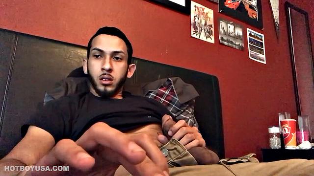 Brian Bonerz starts off in bed, with pants pushed down just enough to release his big stiff cock and balls. He starts stroking and then pauses briefly to remove one of the two shirts he's wearing.