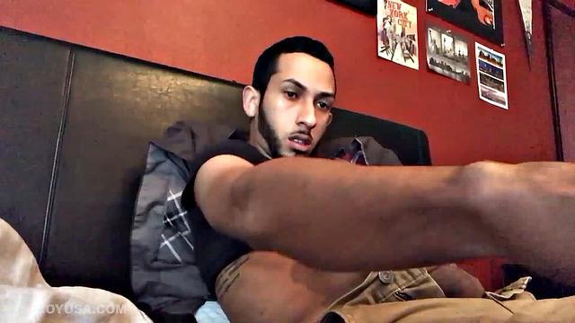 Brian Bonerz starts off in bed, with pants pushed down just enough to release his big stiff cock and balls. He starts stroking and then pauses briefly to remove one of the two shirts he's wearing.