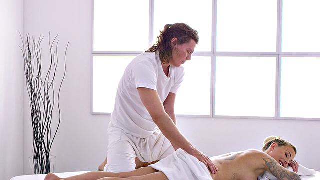 Oiled busty babe deepthroats cock in 69 sex on massage table