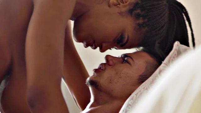 Black huge boobed babe gets banged good and hard on the bed