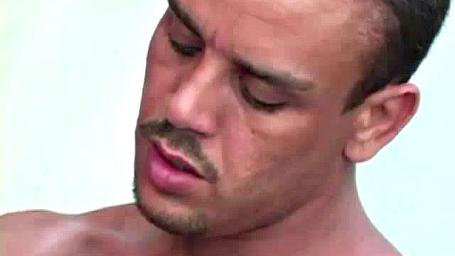 Gomez Aguilar is in his tool shed, upset that he hasn't used his large dick in a while, so Luis de Pavia agrees to help him out. He takes off the one-piece to reveal Gomez's muscles and obscenely large cock, and sucks it valiantly.