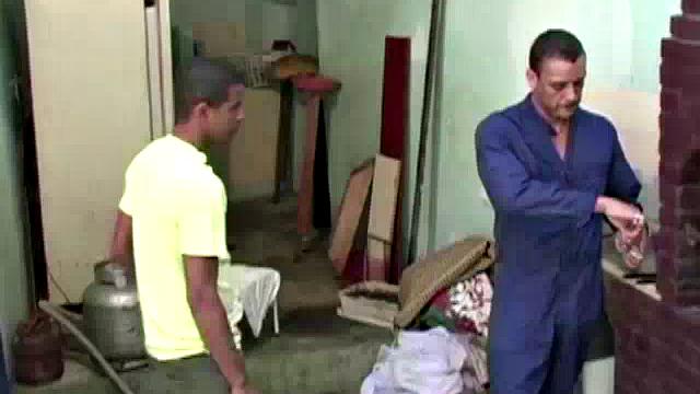 Gomez Aguilar is in his tool shed, upset that he hasn't used his large dick in a while, so Luis de Pavia agrees to help him out. He takes off the one-piece to reveal Gomez's muscles and obscenely large cock, and sucks it valiantly.