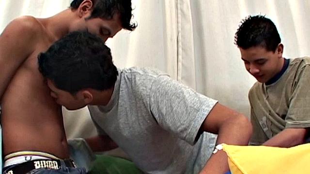 Latin twinks Alfredo, Alejandro and Alfonso are in bed, undressing, as they start the threesome cock sucking. By the time all three are naked, each has a big uncut cock in his mouth and one is taking a dildo up his skinny ass.