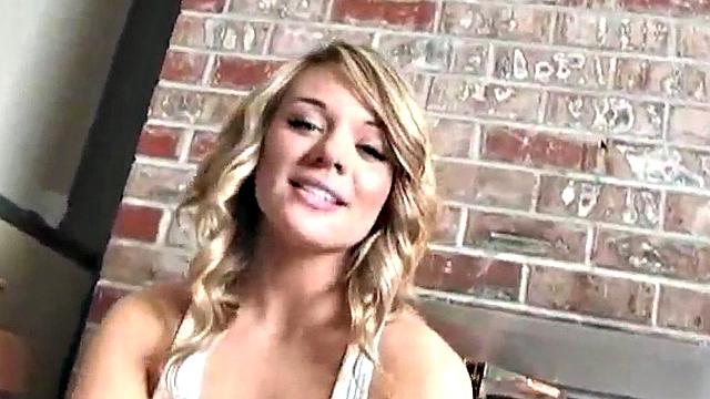 Sexy blonde dripping wet as she soaks her shirt