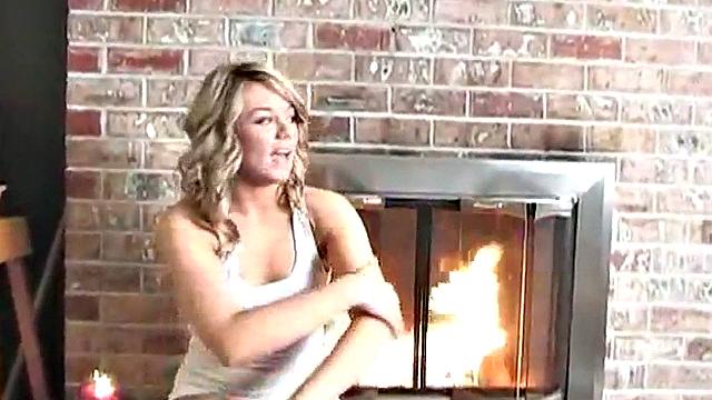 Sexy blonde dripping wet as she soaks her shirt