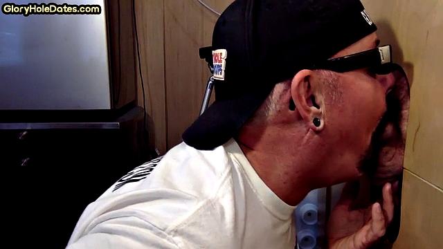 Homemade DILF sucks and wanks through gloryhole