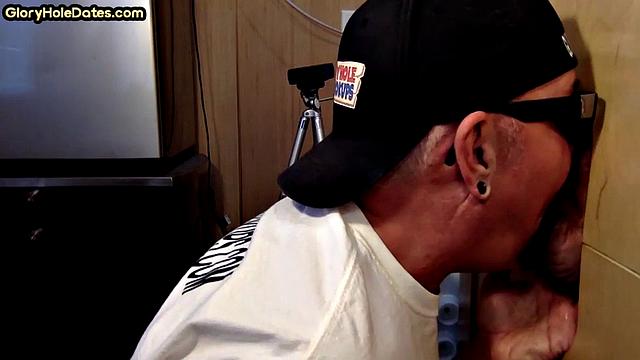 Homemade DILF sucks and wanks through gloryhole