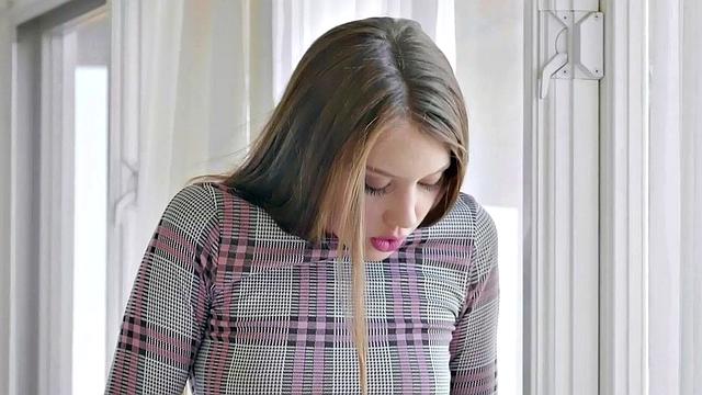 A brown-haired babe with lingerie and small tits pleasure herself in jeans and stockings