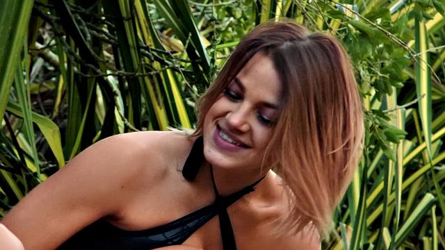 Tattooed lesbians explore each other's bodies in nature and lingerie