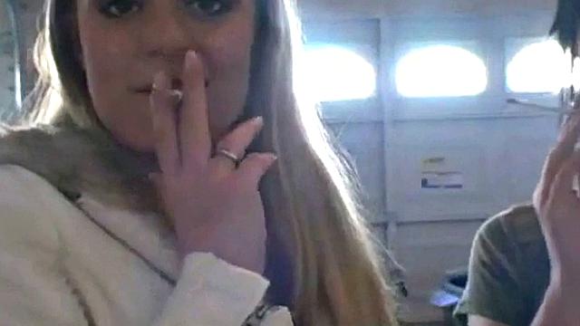 Hot teen Andi smoking in the loo on the sly