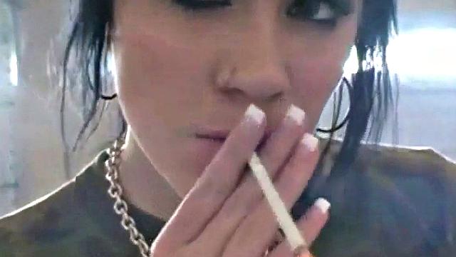 Hot teen Andi smoking in the loo on the sly