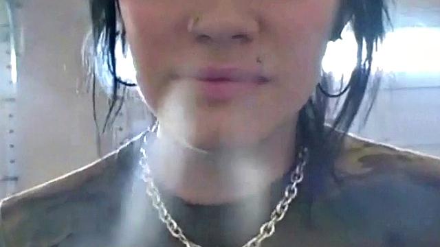 Hot teen Andi smoking in the loo on the sly