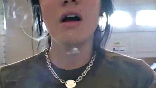 Hot teen Andi smoking in the loo on the sly