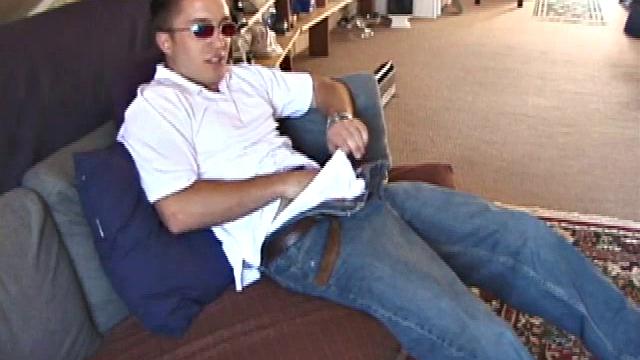 Johnny is back and this time he' swearing a preppy polo shirt and shades. He quickly settles down and gets into his alone time. After oiling up his cock, Johnny strokes it while watching a porn video, and occasionally narrating.