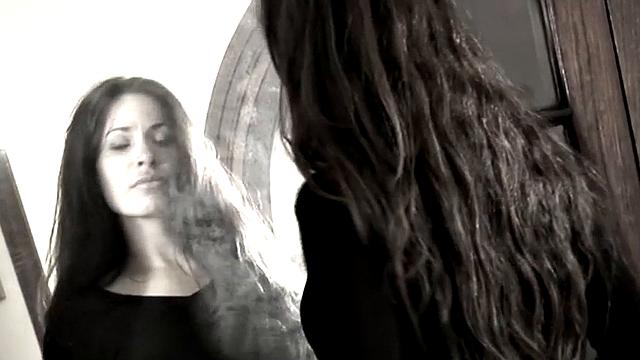 Leggy Nina does a striptease