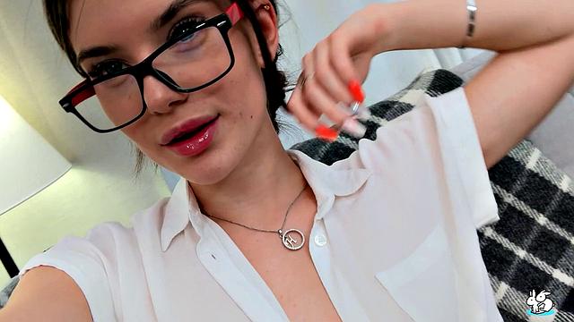 Teen In Glasses Plays With a Glass Dildo