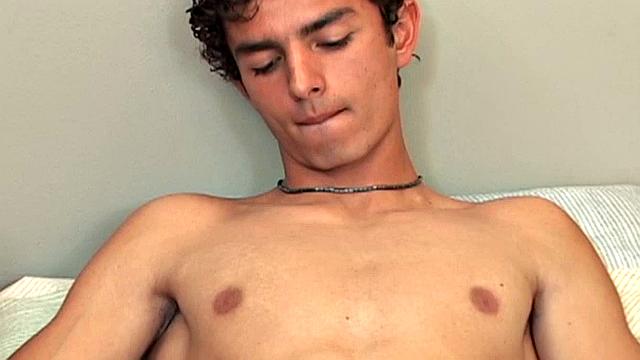 Armando is on the bed removing his clothes, ready to jack off with a front row seat.