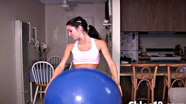 Hot teen gets nake on stability ball and fingers herself