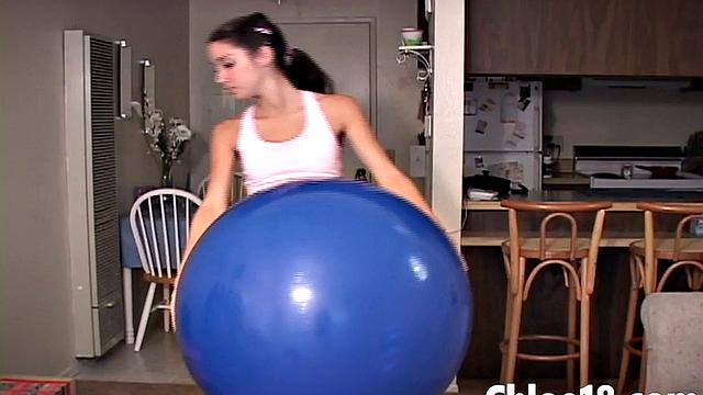 Hot teen gets nake on stability ball and fingers herself