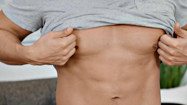 Solo athletic jock passionately stroking his cock