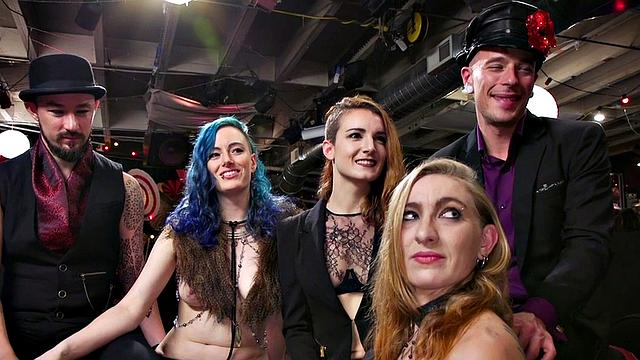 Blonde dominas fist their bound lesbian friends in a wild public orgy