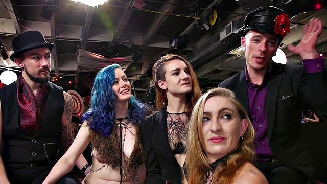 Blonde dominas fist their bound lesbian friends in a wild public orgy