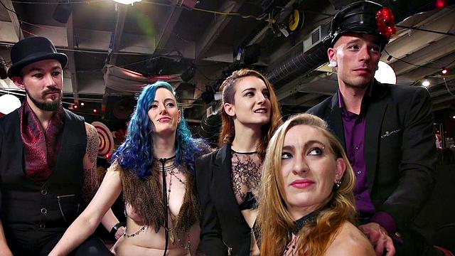 Blonde dominas fist their bound lesbian friends in a wild public orgy