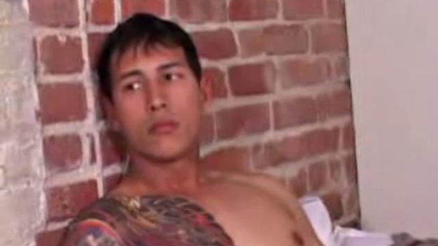 Young Eric Wynn goes into the bedroom to play with himself. Naked and hard, he jerks off with determination. After a nice long stroke, Eric launches a messy cum load onto his inked chest.