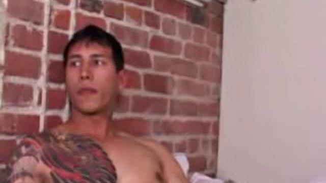 Young Eric Wynn goes into the bedroom to play with himself. Naked and hard, he jerks off with determination. After a nice long stroke, Eric launches a messy cum load onto his inked chest.