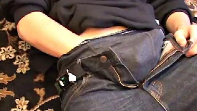 After coming back from skateboarding, Christian Wilde gets a stiff one thru his pants and pulls it out. Some double-handed stroking finally sends a cum gusher onto his chest.