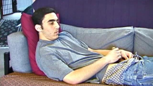 After a close-up of jeans being unzipped, Karod kicks back on the sofa and rubs a growing bulge through his boxers. If his complexion is less than perfect, his lean torso, hairy legs and thick happy trail more than compensate.