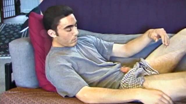 After a close-up of jeans being unzipped, Karod kicks back on the sofa and rubs a growing bulge through his boxers. If his complexion is less than perfect, his lean torso, hairy legs and thick happy trail more than compensate.