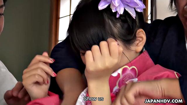 Kimono lady Tsuna Kimura is with three men