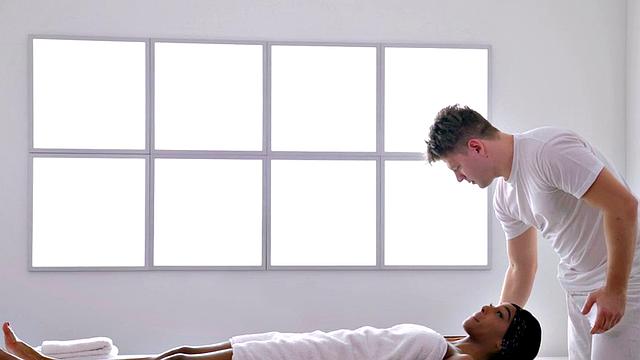 Sensual ebony making love on massage