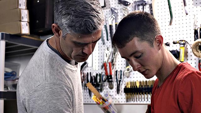 Watch this dominant dad take control and fuck his eager son at the workbench