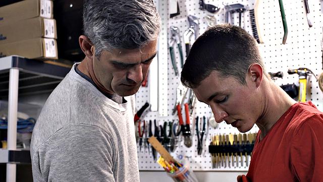 Watch this dominant dad take control and fuck his eager son at the workbench